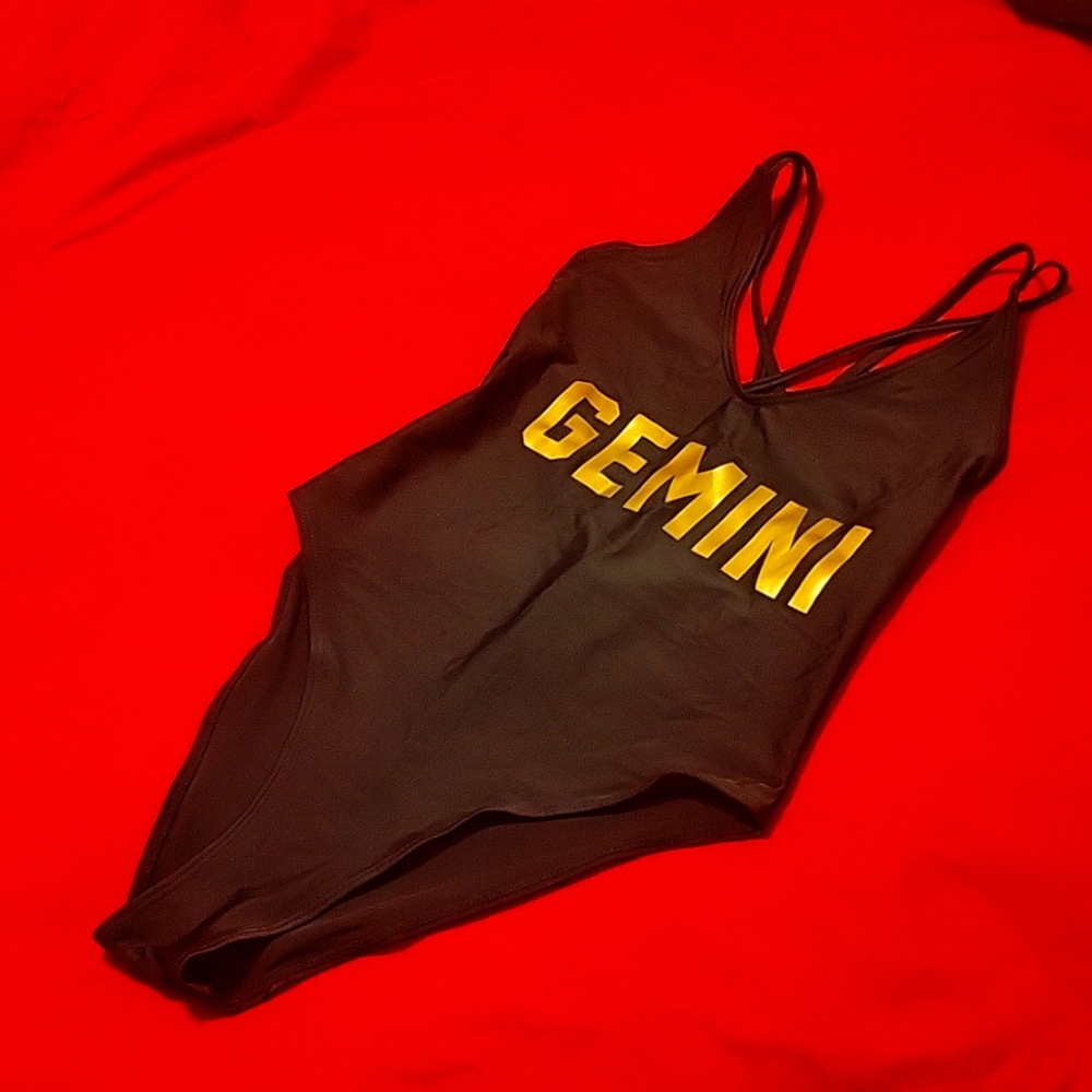 Black "Gemini" onepiece swimsuit with double Crisscross straps and gold letters